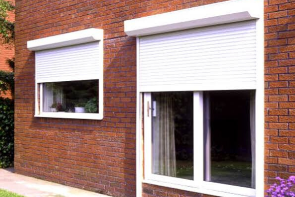 The Brick Wall And Two Windows With PVC Rolling Shutters For Best soundproofing Shutter For Your Home.